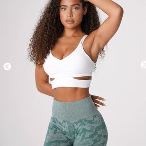 Sports bra includes double shoulder straps & lower crossbody wrap